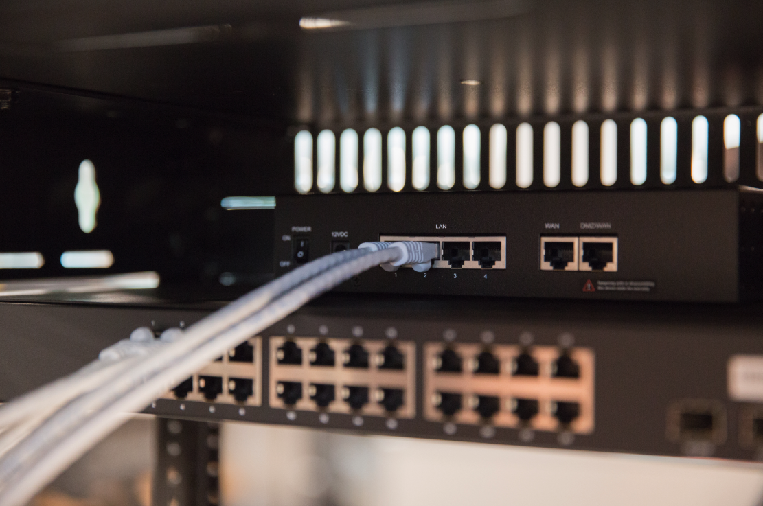 Server rack with network monitoring dashboard