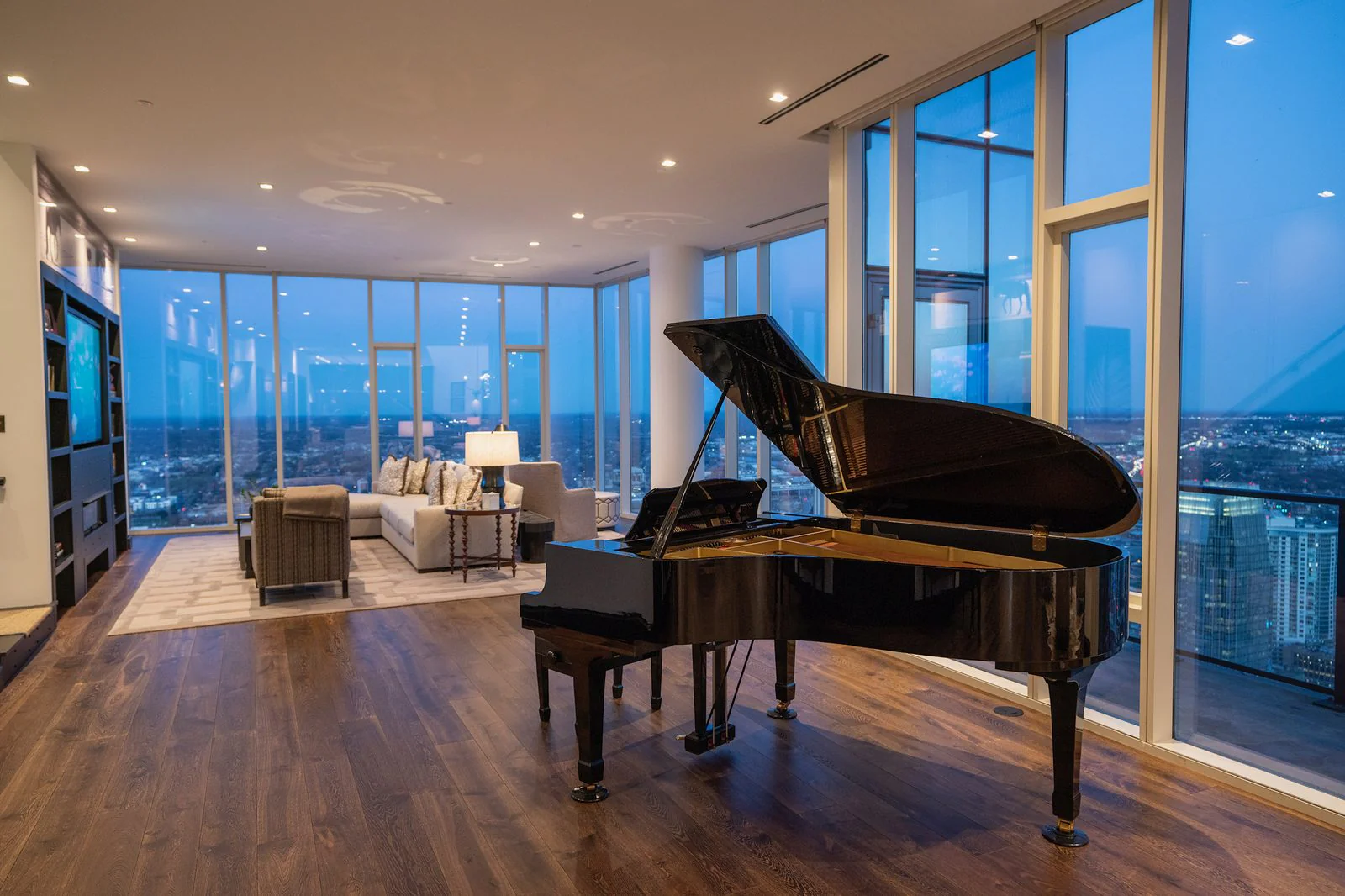 A penthouse kitchen and dining space with concealed speakers