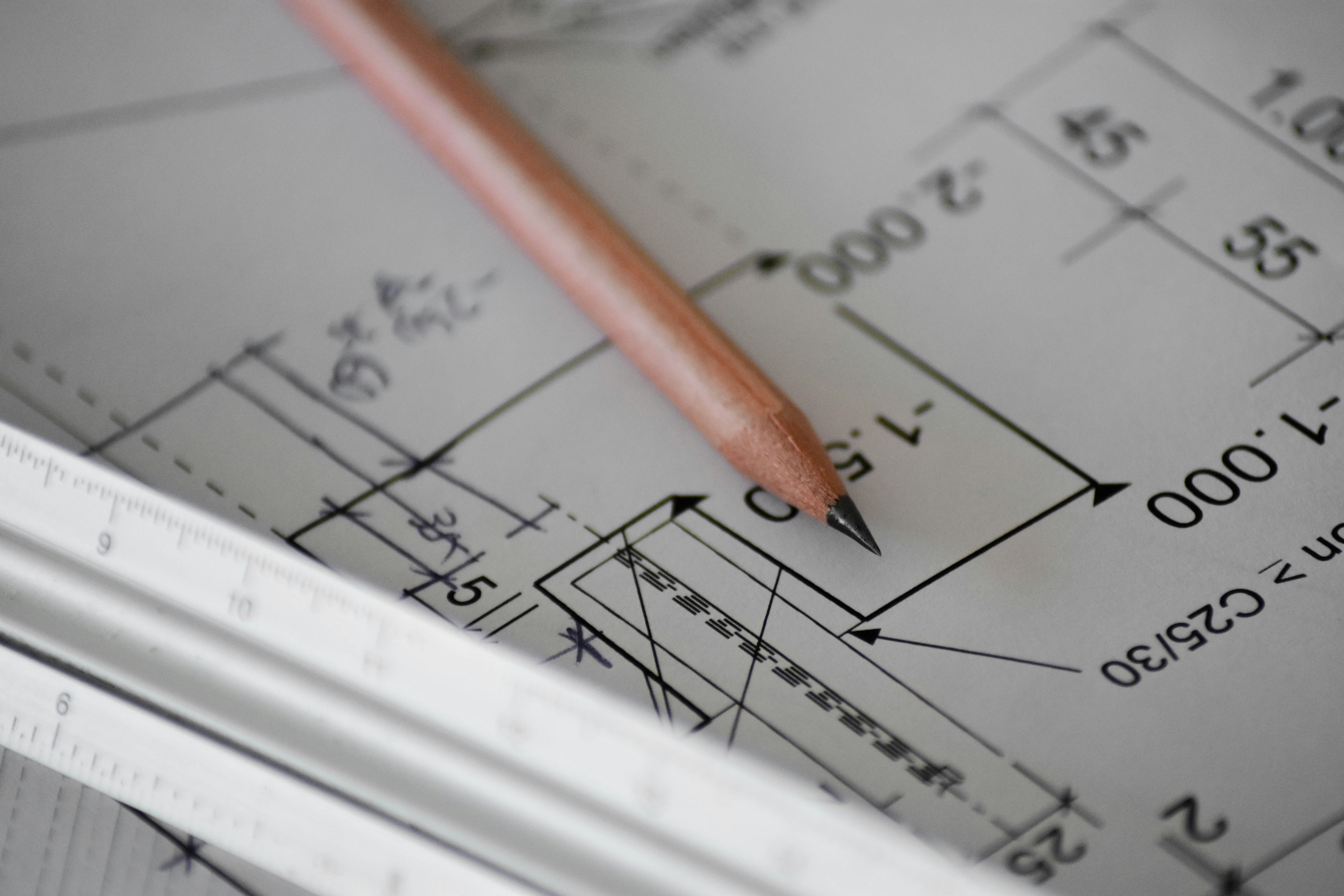 Builder reviewing plans on site