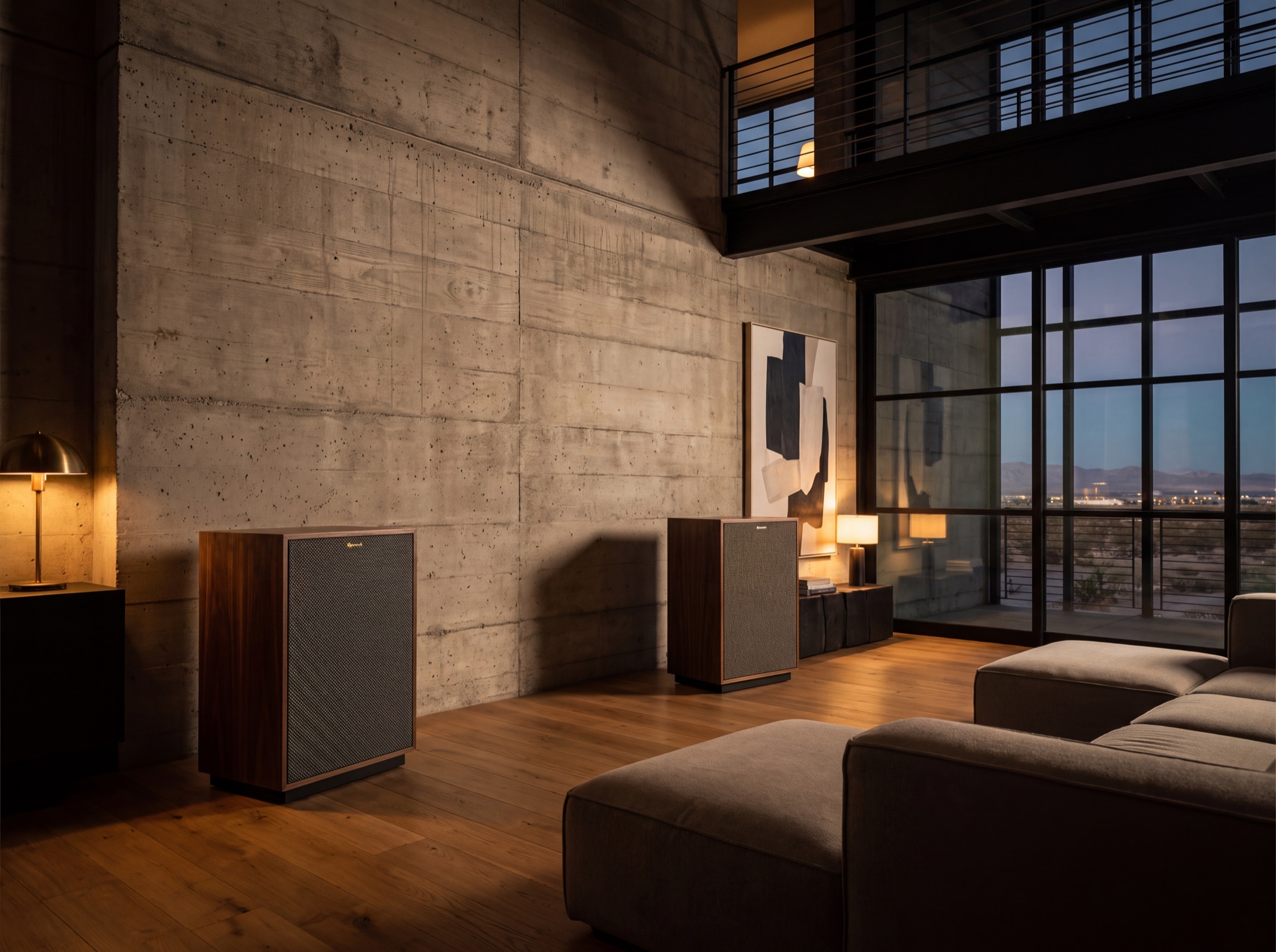 Board-formed concrete and oak living space at dusk, audio built into the architecture rather than added to it