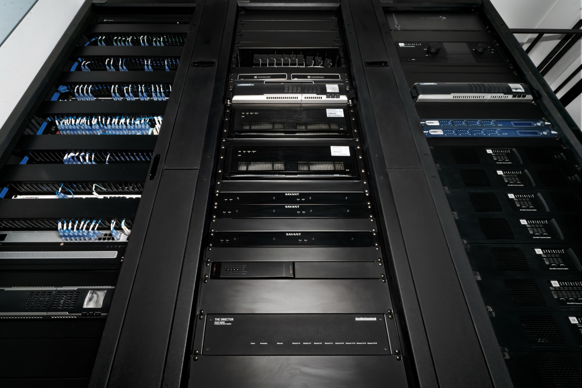 Three-bay rack as handed over: patching dressed and labeled, sources and amplification racked