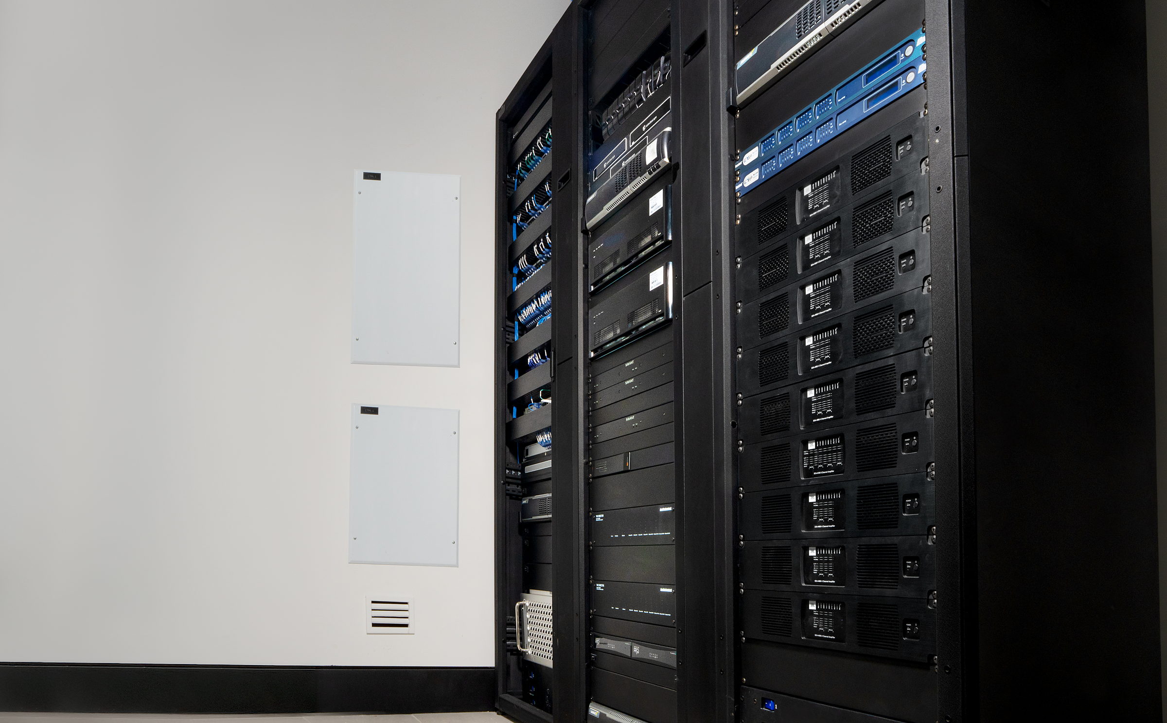 Two-bay CORVX rack room built to be worked in: racks aligned, clearance front and back, nothing stacked on the floor