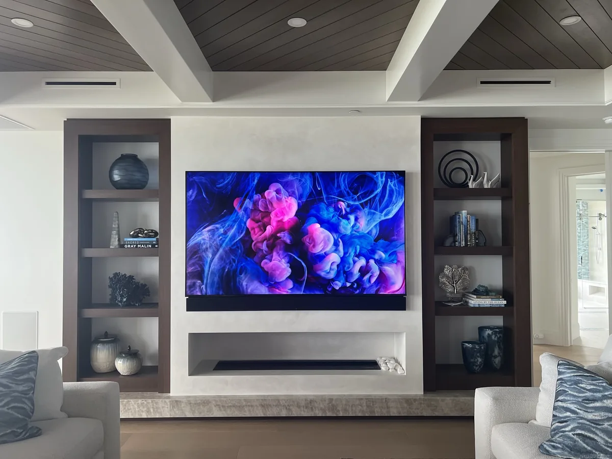Media wall, the display set flush between the cabinetry.