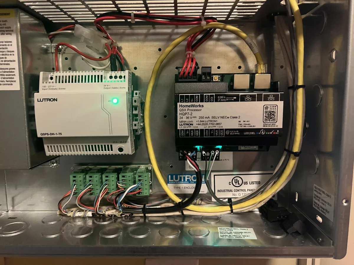 A Lutron HomeWorks QSX processor, wired in its enclosure.